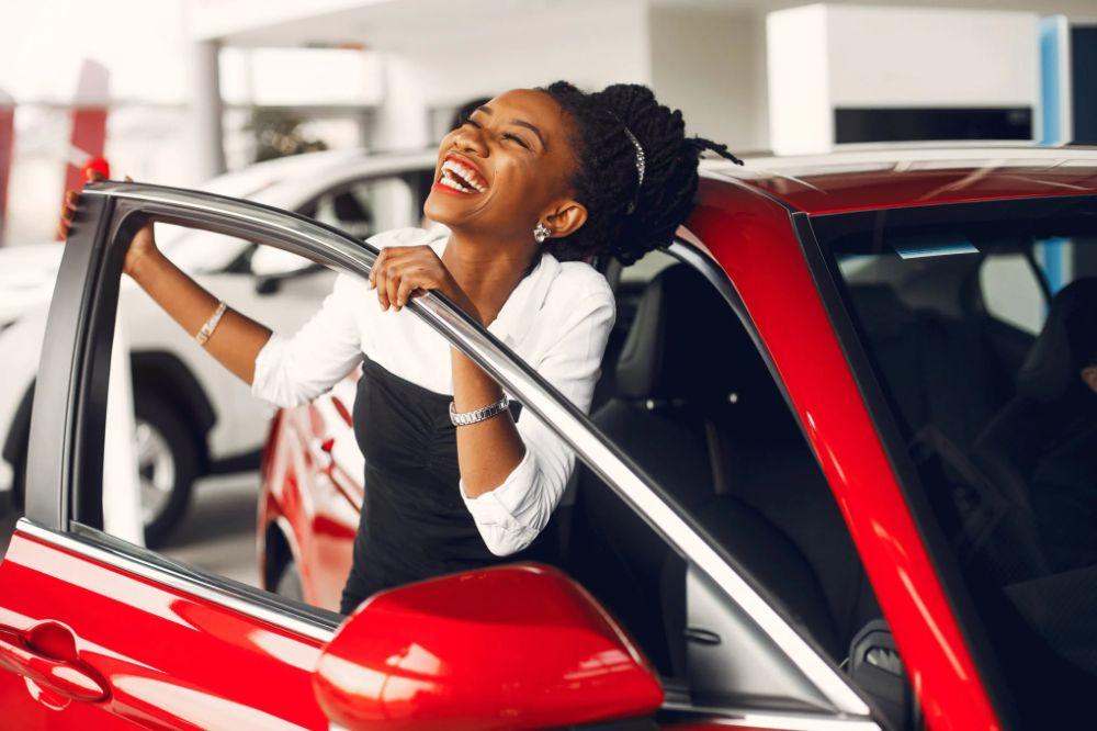 Customer receiving car keys at TJ Auto