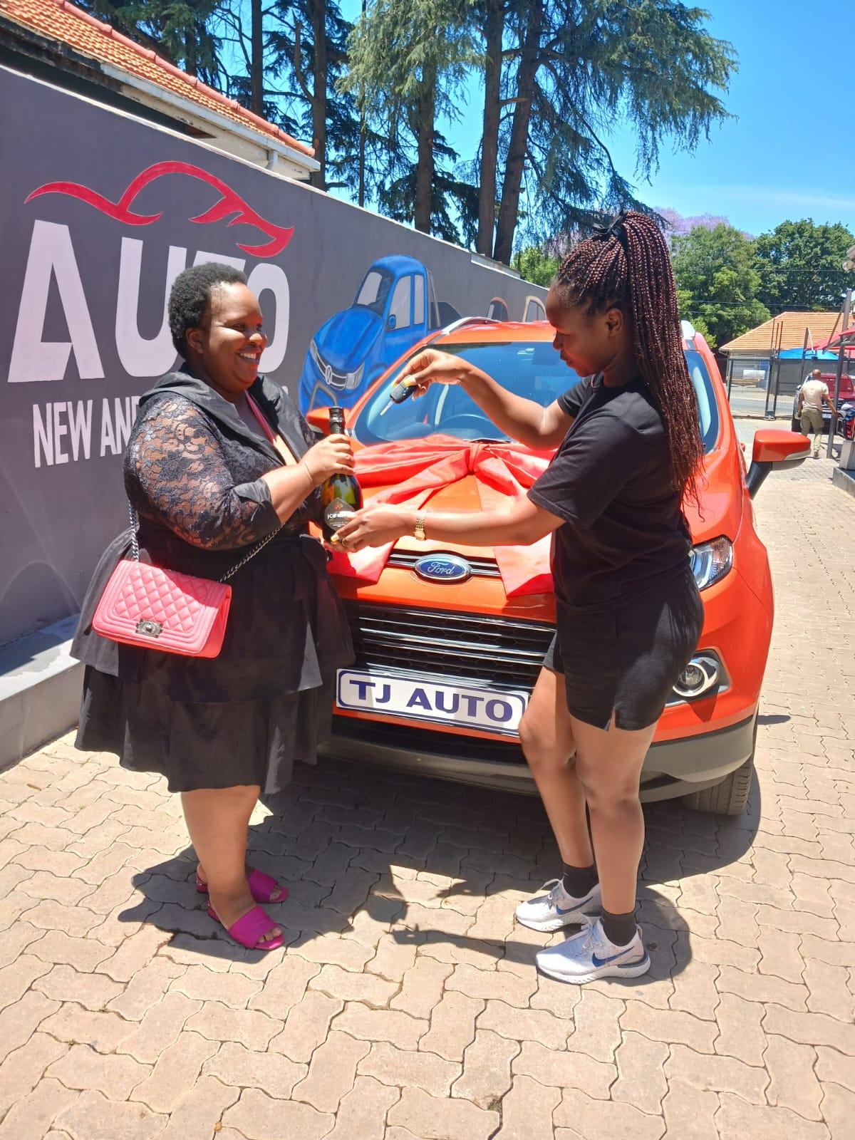 Happy customer at TJ Auto dealership